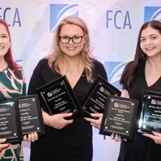 Tri Sigmas accept awards from the Fraternity Communications Association